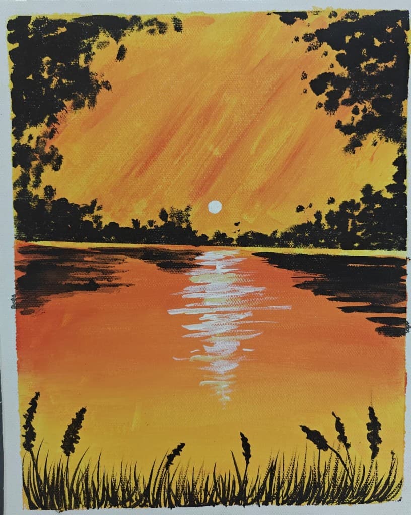 Orange sunset reflected across water with dark tree and grass silhouettes