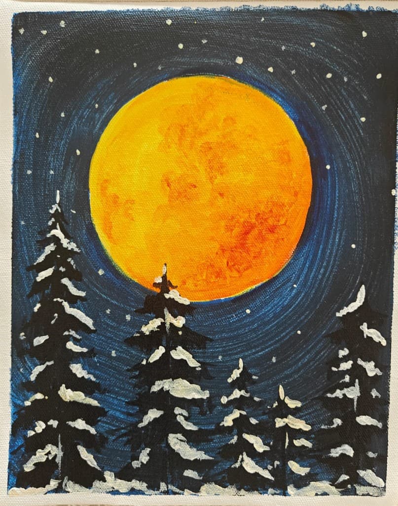 Golden full moon above snow-covered pine trees in a dark blue night sky